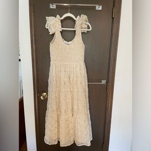 Embroidered flutter sleeve midi dress in cream (pictured on model in black)